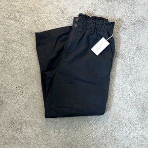 Never worn, black was pants with ruffles at waist, straight leg.